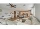 Open living room featuring a sectional sofa and kitchen views at 3740 S 182Nd Ln, Goodyear, AZ 85338