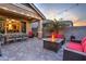 Backyard patio with fire pit, seating, and string lights at 3894 E Ebano St, Gilbert, AZ 85295