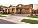 Craftsman style home with stone accents and a two-car garage at 3894 E Ebano St, Gilbert, AZ 85295