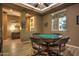 Casual game room with a pool table and built-in shelving at 3894 E Ebano St, Gilbert, AZ 85295