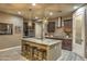 Spacious kitchen with an island and dark wood cabinets at 3894 E Ebano St, Gilbert, AZ 85295