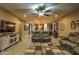 Relaxing living room with leather couches and a large TV at 3894 E Ebano St, Gilbert, AZ 85295