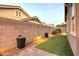 Landscaped side yard with artificial turf and lighting at 3894 E Ebano St, Gilbert, AZ 85295