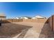 Spacious backyard with a new home and block wall at 40130 W Sunland Dr, Maricopa, AZ 85138