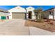 New construction home with two-car garage and desert landscaping at 40130 W Sunland Dr, Maricopa, AZ 85138