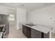 Modern kitchen island with double sink and dishwasher at 40130 W Sunland Dr, Maricopa, AZ 85138