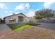 Landscaped backyard with artificial turf and gravel at 40864 W Novak Ln, Maricopa, AZ 85138