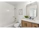 Modern bathroom with a vanity, toilet and shower/tub combo at 40864 W Novak Ln, Maricopa, AZ 85138