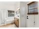 Modern bathroom with double vanity, soaking tub and walk-in shower at 40864 W Novak Ln, Maricopa, AZ 85138