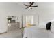 Spacious bedroom with dresser and neutral decor, carpeted floor at 40864 W Novak Ln, Maricopa, AZ 85138