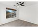 Bright bedroom with carpet flooring and a large window at 40864 W Novak Ln, Maricopa, AZ 85138