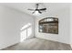 Well-lit bedroom with carpeted floor and large window at 40864 W Novak Ln, Maricopa, AZ 85138