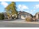 Single-story home with a two-car garage and landscaped front yard at 40864 W Novak Ln, Maricopa, AZ 85138