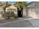 Front entry of a house with a walkway and landscaping at 40864 W Novak Ln, Maricopa, AZ 85138