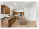 Kitchen with wooden cabinets, stainless steel appliances, and an island at 40864 W Novak Ln, Maricopa, AZ 85138