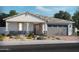 Single-story home with a two-car garage and front landscaping at 4101 S 176Th Dr, Goodyear, AZ 85338