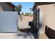 View of backyard access through a metal gate at 4320 W Keim Dr, Glendale, AZ 85301