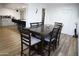 Dining area with dark wood table and six chairs, kitchen view at 4320 W Keim Dr, Glendale, AZ 85301