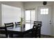 Dining area with dark wood table and chairs near entry at 4320 W Keim Dr, Glendale, AZ 85301