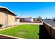 Neatly landscaped front yard with green grass and decorative plants at 4320 W Keim Dr, Glendale, AZ 85301