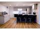 Modern kitchen with gray cabinets, island, and stainless steel appliances at 4320 W Keim Dr, Glendale, AZ 85301