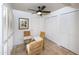 Small breakfast nook with wicker chairs and built-in shelving at 4446 E Camelback Rd # 109, Phoenix, AZ 85018