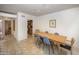 Dining area with wood table and view into kitchen at 4446 E Camelback Rd # 109, Phoenix, AZ 85018