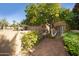 Front entry with lemon tree and brick walkway at 4446 E Camelback Rd # 109, Phoenix, AZ 85018