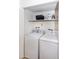 Stacked washer and dryer in a well-lit laundry closet at 4446 E Camelback Rd # 109, Phoenix, AZ 85018