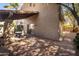 Brick patio with covered seating area and outdoor table at 4446 E Camelback Rd # 109, Phoenix, AZ 85018