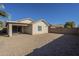 Backyard view of house with gravel and block wall at 44865 W Horse Mesa Rd, Maricopa, AZ 85139