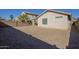 Backyard view of house with gravel and block wall at 44865 W Horse Mesa Rd, Maricopa, AZ 85139