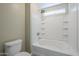 Clean bathroom with shower/tub combo and built-in shelving at 44865 W Horse Mesa Rd, Maricopa, AZ 85139