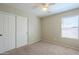 Bedroom with double door closet and window with blinds at 44865 W Horse Mesa Rd, Maricopa, AZ 85139