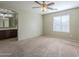 Large bedroom with ceiling fan and ensuite bathroom access at 44865 W Horse Mesa Rd, Maricopa, AZ 85139