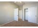 Spacious bedroom with double door closet and neutral carpeting at 44865 W Horse Mesa Rd, Maricopa, AZ 85139