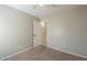 Simple bedroom with door to bathroom and neutral walls at 44865 W Horse Mesa Rd, Maricopa, AZ 85139