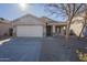 Single-story house with a two-car garage and desert landscaping at 44865 W Horse Mesa Rd, Maricopa, AZ 85139