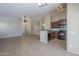 Kitchen features dark wood cabinets and black appliances at 44865 W Horse Mesa Rd, Maricopa, AZ 85139