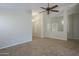 Spacious living room featuring tile floors and a ceiling fan at 44865 W Horse Mesa Rd, Maricopa, AZ 85139