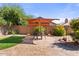 Backyard with patio, shade structure, and lush landscaping at 4601 E Peak View Rd, Cave Creek, AZ 85331