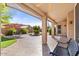 Covered patio with tile flooring, seating area, and artificial turf at 4601 E Peak View Rd, Cave Creek, AZ 85331