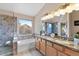 Bathroom with granite double vanity, soaking tub, and walk-in shower at 4601 E Peak View Rd, Cave Creek, AZ 85331