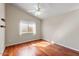 Bright bedroom with hardwood floors and ceiling fan at 4601 E Peak View Rd, Cave Creek, AZ 85331