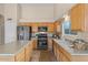 Kitchen with light wood cabinets, granite counters, and stainless steel appliances at 4601 E Peak View Rd, Cave Creek, AZ 85331