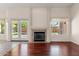 Living room with hardwood floors, fireplace, and patio doors at 4601 E Peak View Rd, Cave Creek, AZ 85331