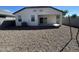 Desert landscape surrounds this home's spacious backyard, complete with a covered patio at 4744 W Orange Ave, Coolidge, AZ 85128