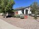 Landscaped front yard with drought-tolerant plants and gravel at 4744 W Orange Ave, Coolidge, AZ 85128