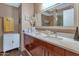 Double vanity bathroom with a large mirror and plenty of counter space at 4808 N 24Th St # 803, Phoenix, AZ 85016