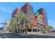 Modern high rise building exterior with palm trees and city street view at 4808 N 24Th St # 803, Phoenix, AZ 85016